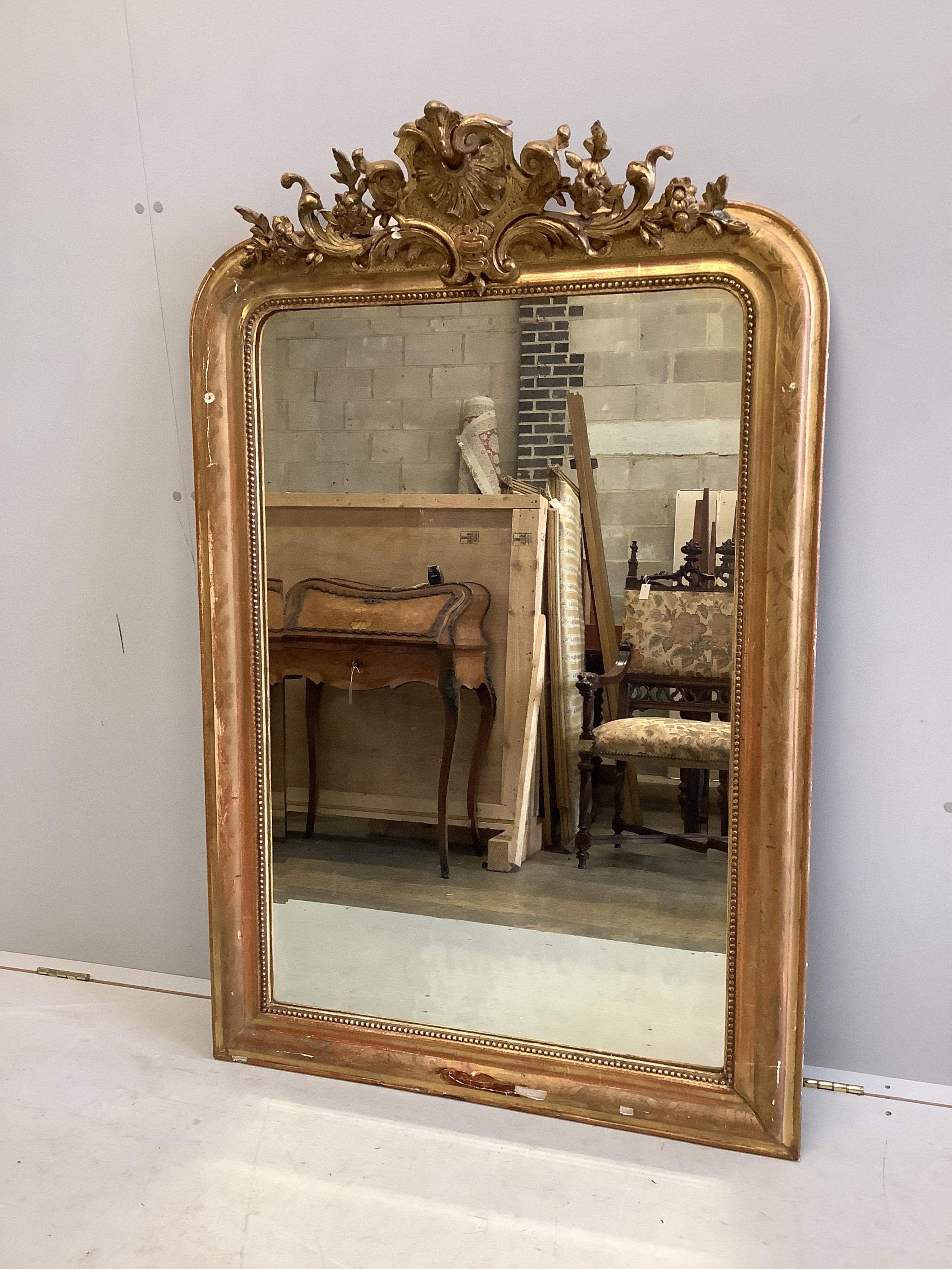 A 19th century French giltwood and composition overmantel mirror, width 92cm, height 140cm. Condition - fair